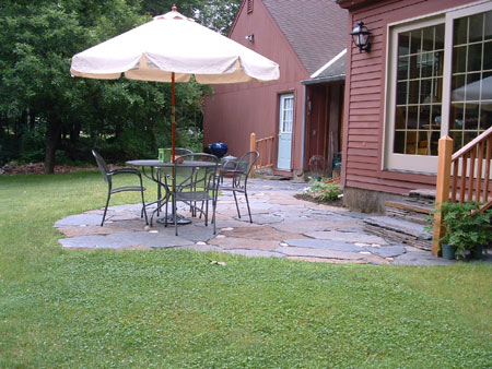 As an addition to a well-designed landscape, a natural, hand-set flagstone patio makes finding opportunities to enjoy it hard to resist.
